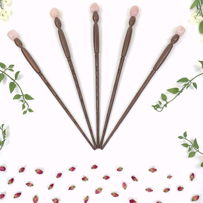 5 Enchantment Wands with floral decor on white background