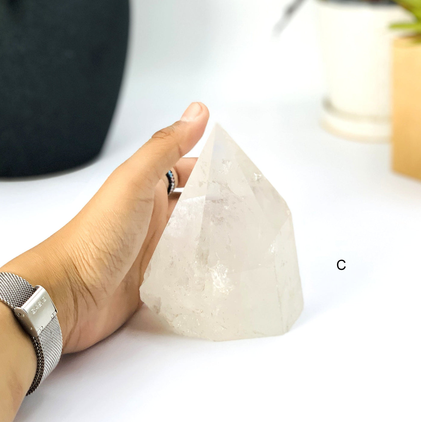 Hand comparing size to Option C - Crystal Quartz Polished Point