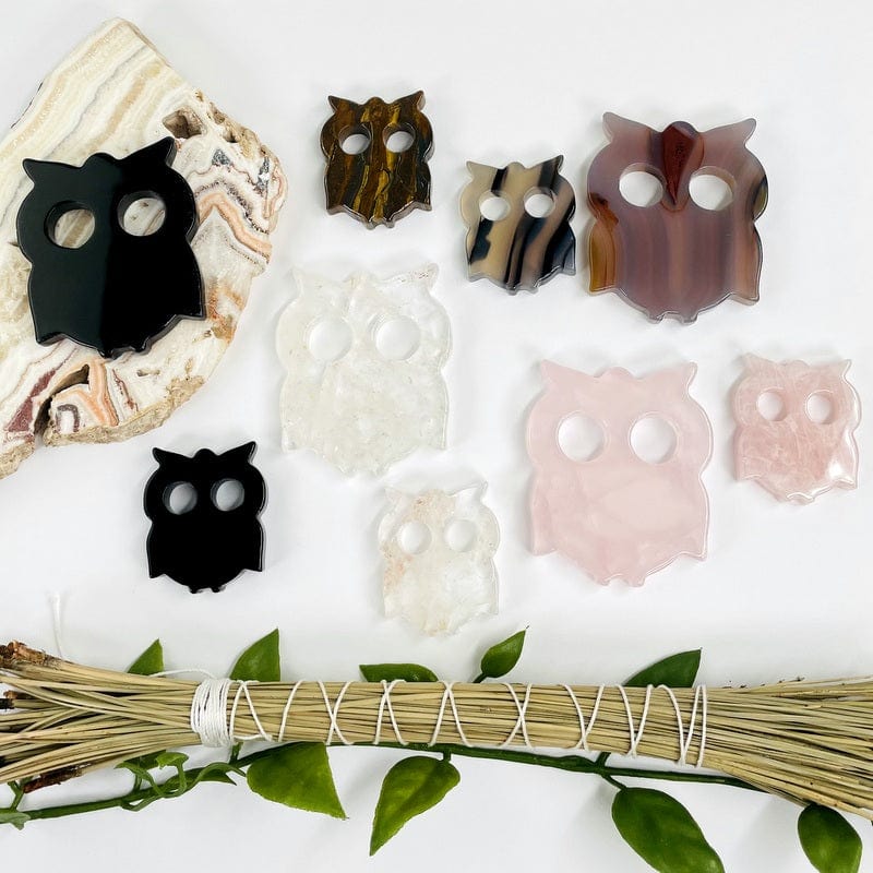 multiple owl shaped gemstones displayed to show the differences in the crystal types and sizes 