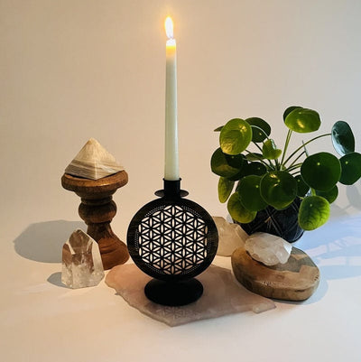 candle holder with a flower of life design set as home decor 