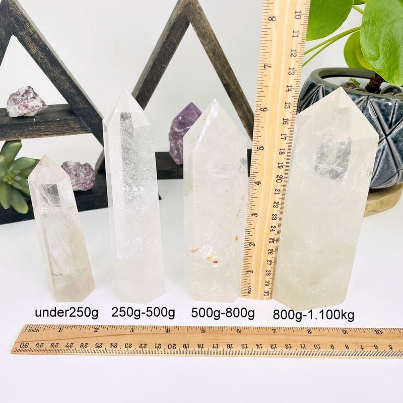 crystal quartz towers next to a ruler for size reference 