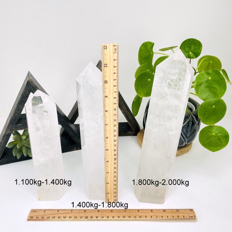 crystal quartz towers next to a ruler for size reference