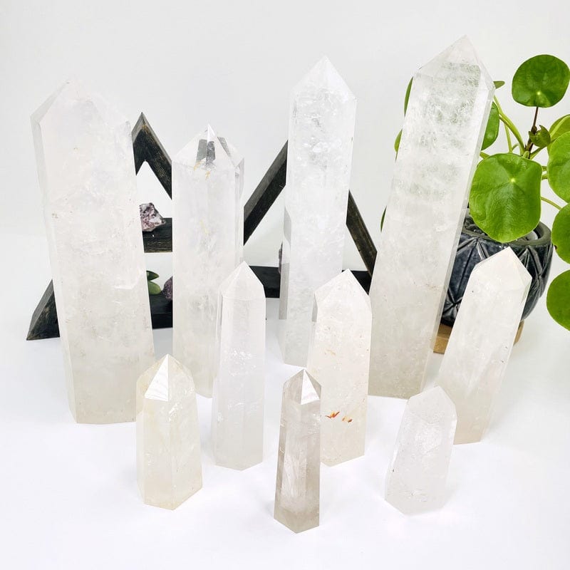 multiple crystal quartz tower points displayed to show the differences in the sizes available 
