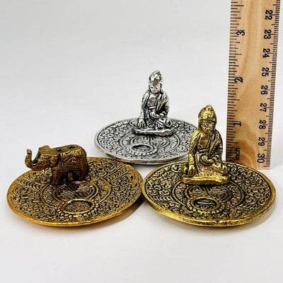 incense burners next to a ruler to show how tall they sit 