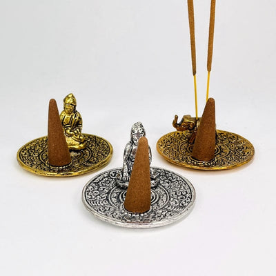 close up of the details on the cone and incense stick burners