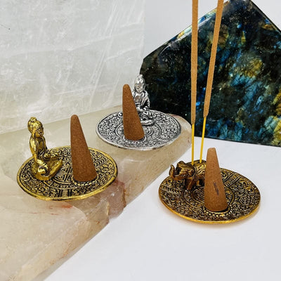 incense burners displayed with cones and incense sticks 
