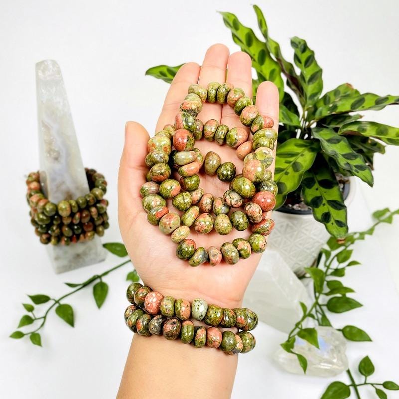 3 Unakite Multi-sized Bead Bracelets in hand to show size