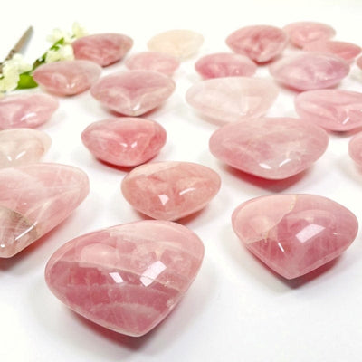 side shot of the rose quartz hearts showing the different thickness 