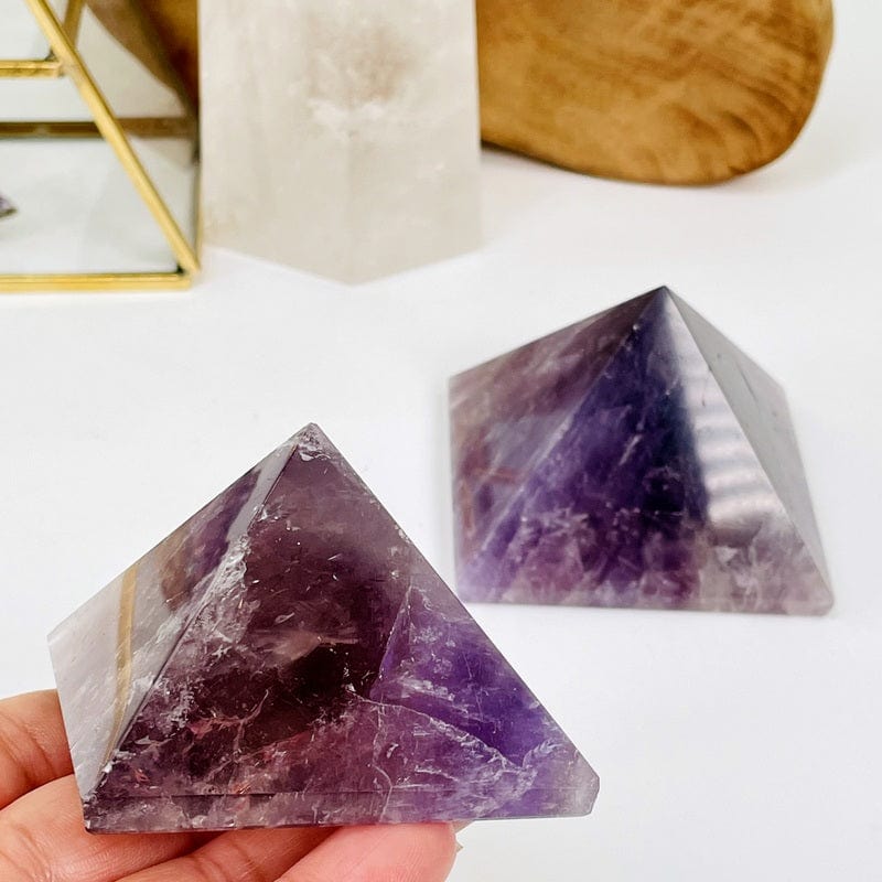 amethyst pyramid in hand for size reference 