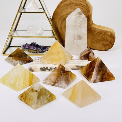 multiple golden healer pyramids displayed to show the differences in the sizes and color shades 