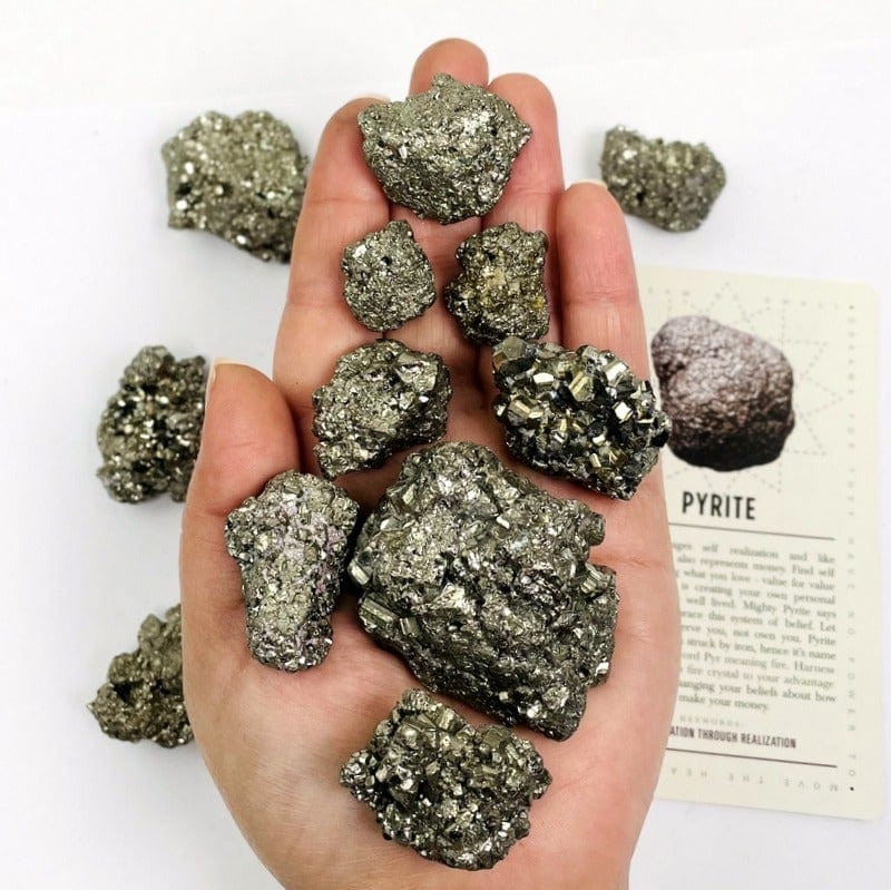 pyrite stones on hand to show size variations