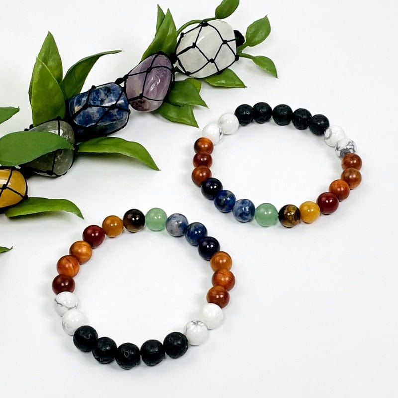 chakra round bead bracelets on white background 