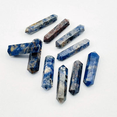 sodalite double terminated pencil points showing different angles on white background 