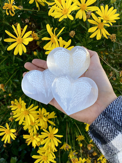 Selenite Stone Heart -3  Selenite Hearts with Angel Wing Engraving in a hand
