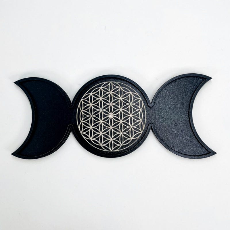 close up of the flower of life that is engraved in the center of this tray 