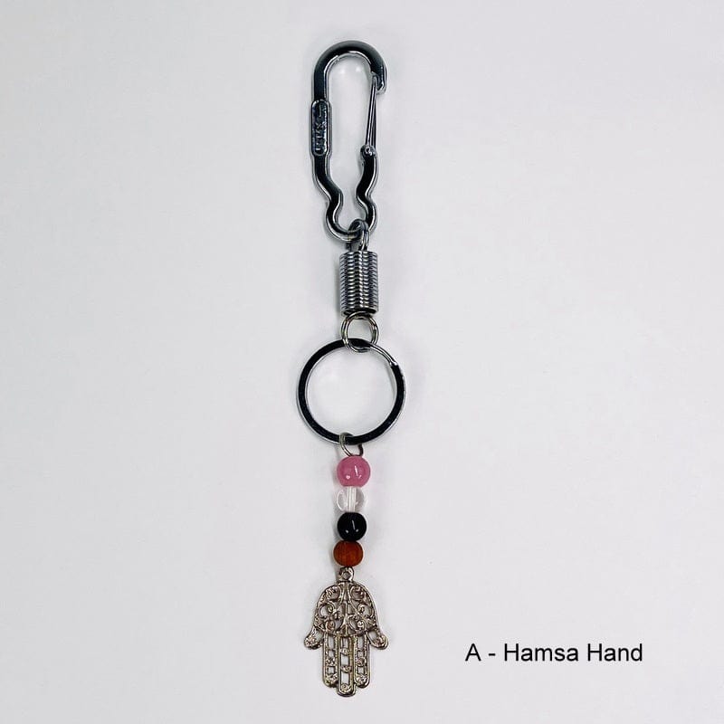 keychain with hamsa hand charm and crystal beads in rose quartz, crystal quartz, amethyst and a wooden bead.