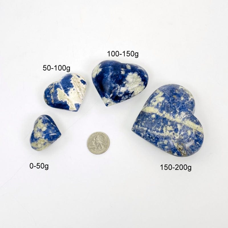 sodalite hearts next to a quarter and their weight for size reference 