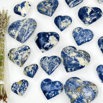 multiple sodalite hearts on a white background 