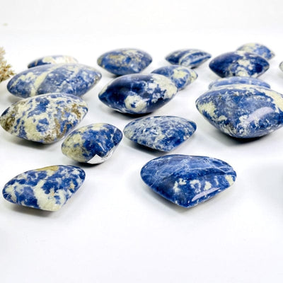 side shot of sodalite hearts showing the thickness 