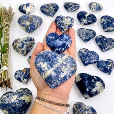 sodalite hearts on hand for size reference 