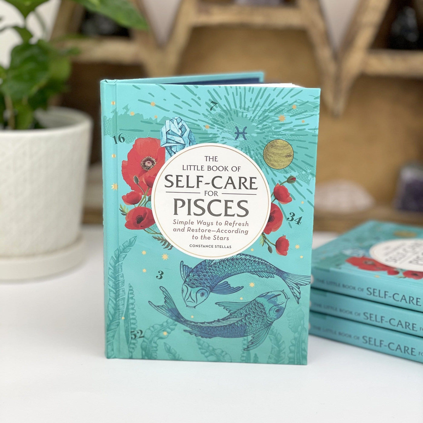 The Little Book of Self-Care for Pisces in a blue color 