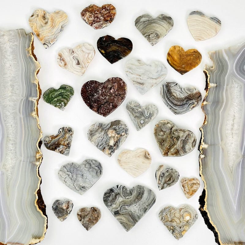 multiple chalcedony hearts on white background 