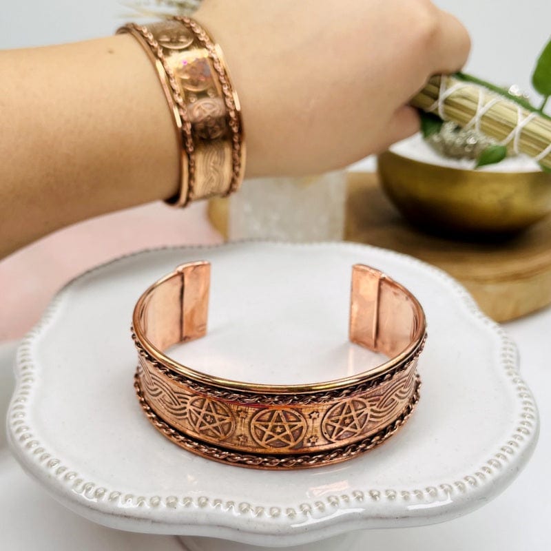 copper bracelet decorated with stars and chain 