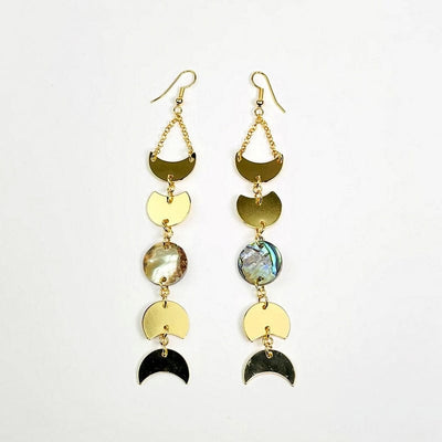 gold moon phase earrings with a abalone center accent on a white background 