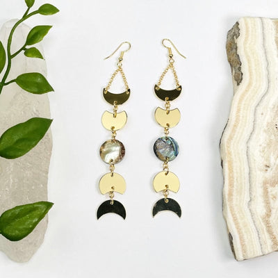 gold moon phase earrings with a abalone center accent 