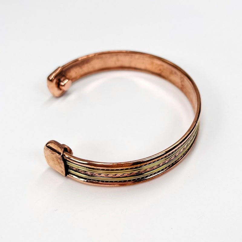 side view of the copper bracelet. design goes from one end to the other end 