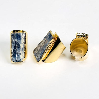 multiple angles of blue kyanite gold cigar band adjustable rings