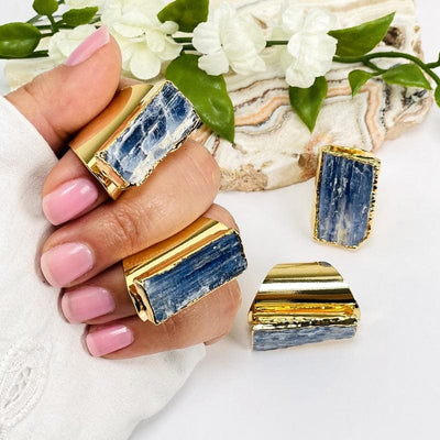 blue kyanite gold cigar band adjustable rings on hand for size reference