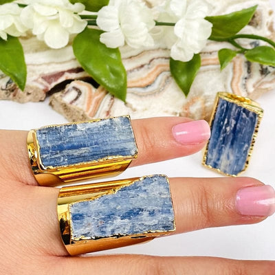 close up of blue kyanite gold cigar band adjustable rings