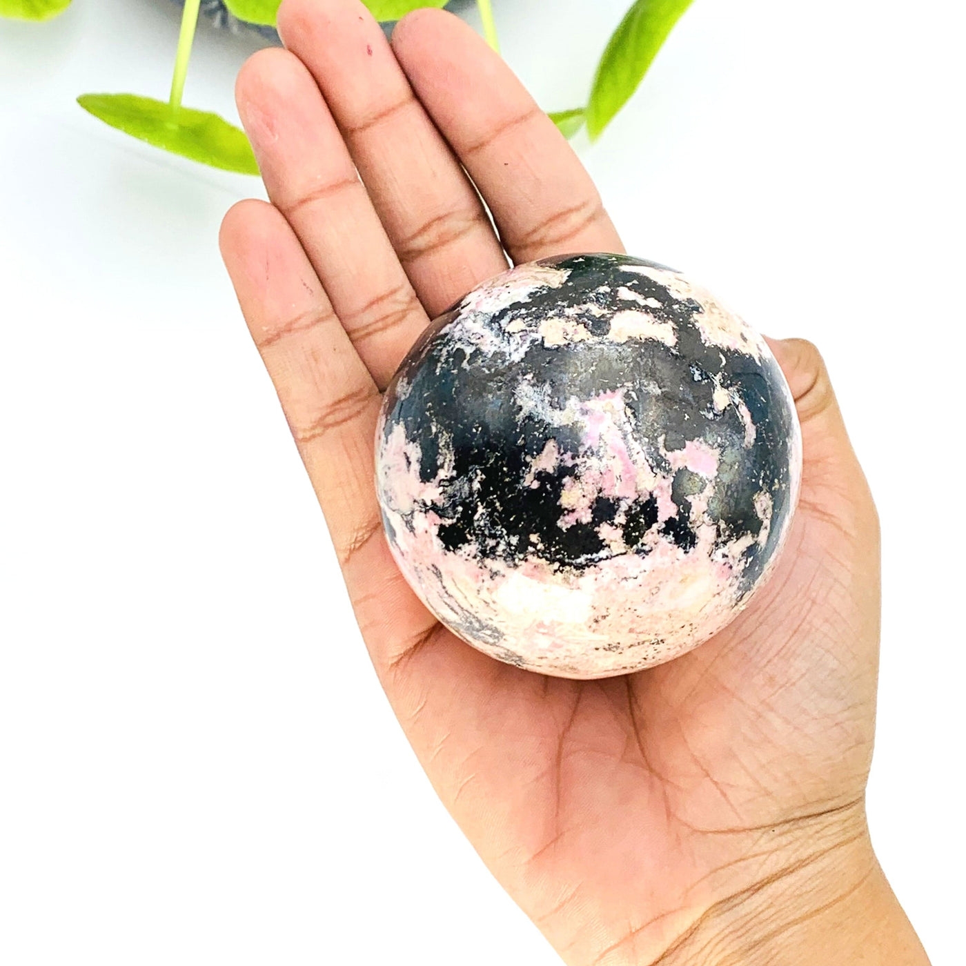 Rhodonite Sphere on hand