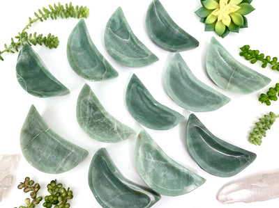 multiple Green Aventurine Stone Moon Dishes to show variations in color and natural inclusions