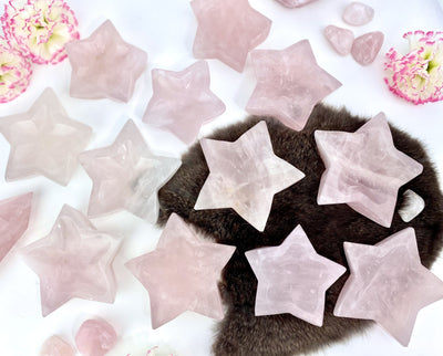 Rose Quartz Stone Star Dishes scattered on background with decorations