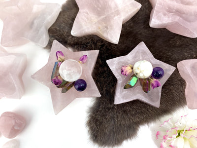 2 Rose Quartz Stone Star Dishes filled with crystals with others in the background with decorations