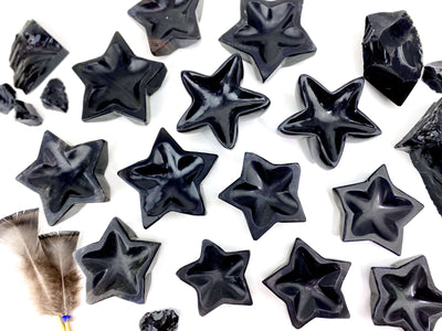 Black Obsidian Stone Star Dishes spread out on a table showing variances in size and shape