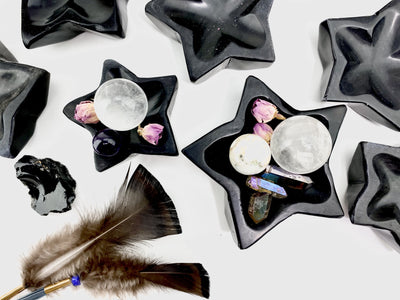 Black Obsidian Stone Star Dishes on display with trinkets inside the dishes