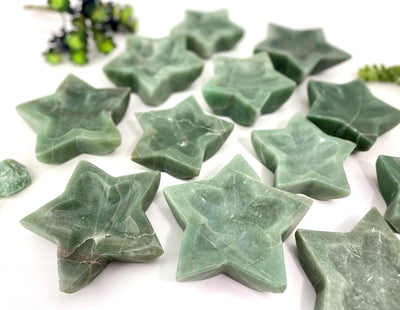 close up of green aventurine star dishes