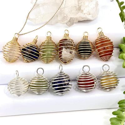 6 gold tumbled stone cage pendant with 5 silver tumbled stone cage pendants