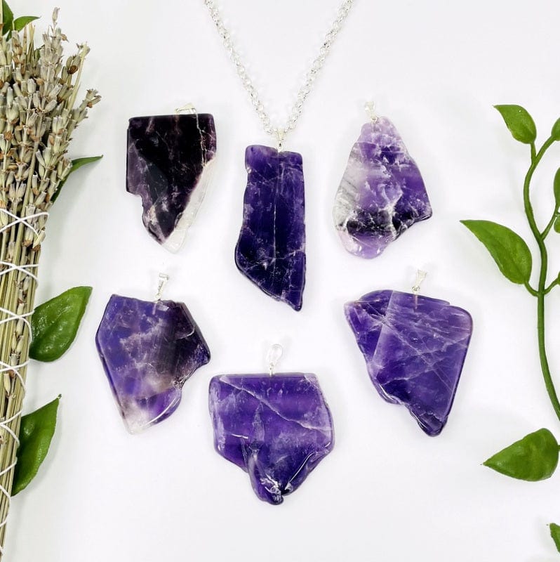 amethyst slab pendants with silver bail on white background 