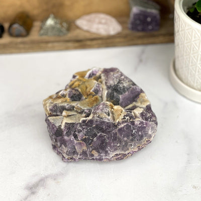 Amethyst Cluster with Calcite Formation with decorations in the background