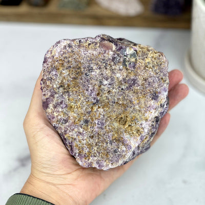 hand holding up Amethyst Cluster with Calcite Formation