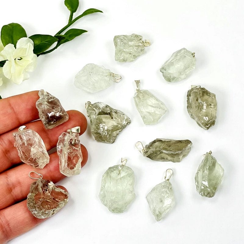 green amethyst with bail in a hand