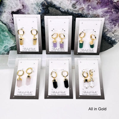 crystal earrings electroplated in gold displayed together. available in citrine, amethyst, green quartz, rose quartz, black obsidian and crystal quartz 