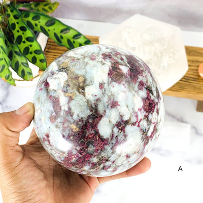 Close up of Option A -  Lepidolite Sphere on hand