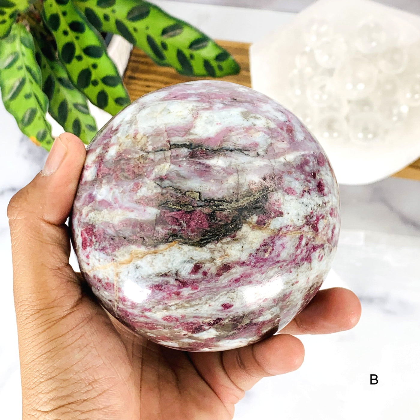 Close up of Option B- Lepidolite Sphere on hand