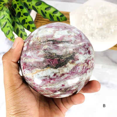 Close up of Option B- Lepidolite Sphere on hand