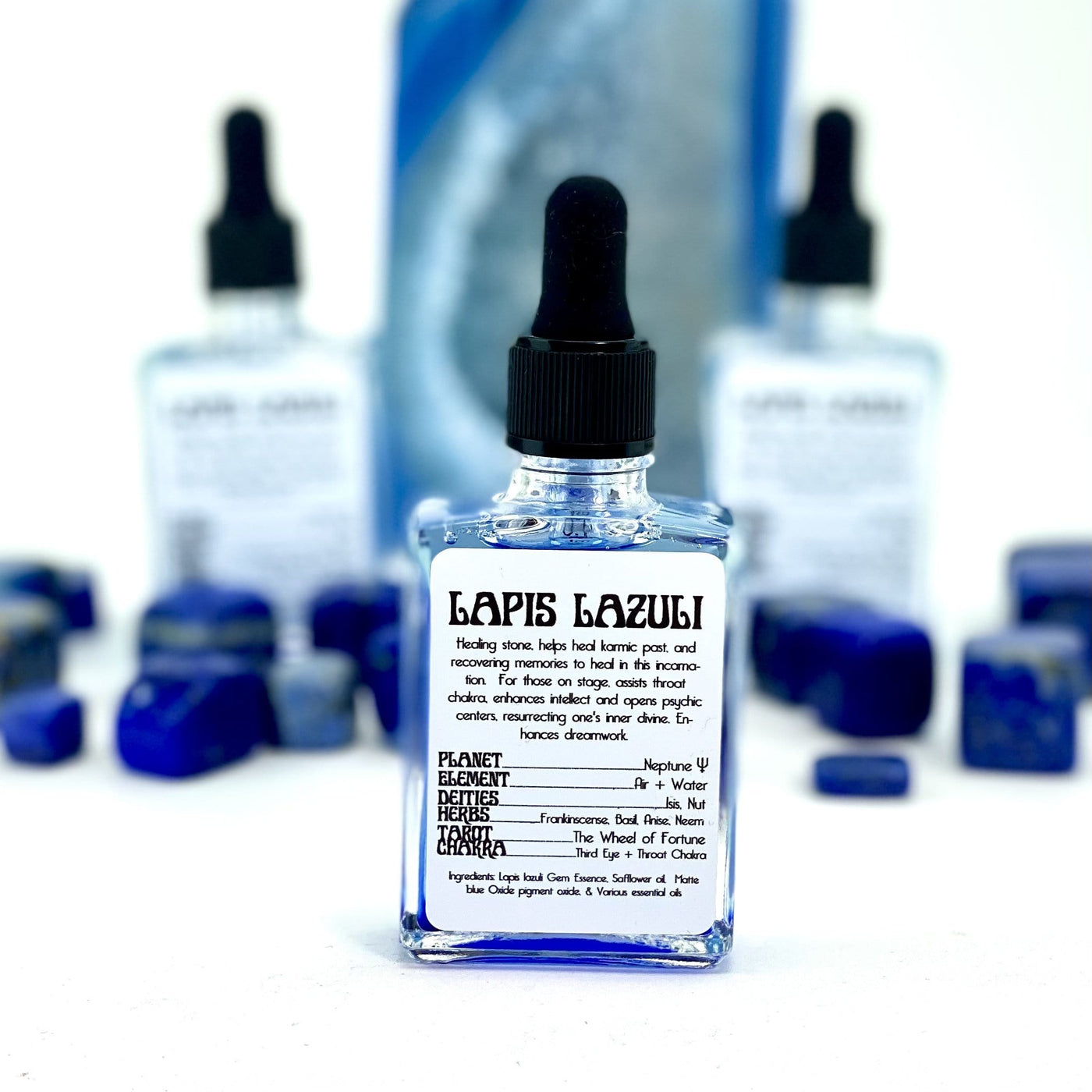 front of the Lapis Lazuli Gem Essence bottle promoting properties and what they align with planet element deities herns tarot chakra